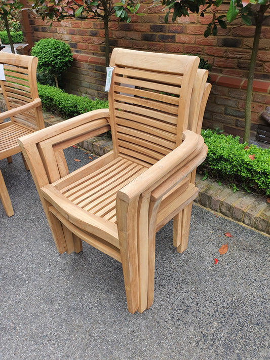 Dartmouth teak armchairs stacked for storage
