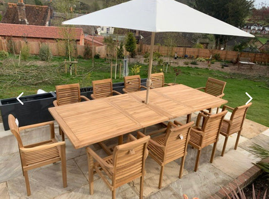 Dartmouth 10 seater teak garden dining set under a parasol