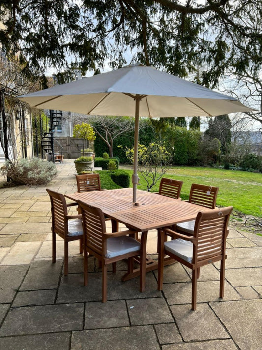 3m garden parasol open over a garden dining table and chairs